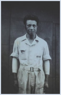 Yoshida in his grocery wholesaler uniform, est. 1950